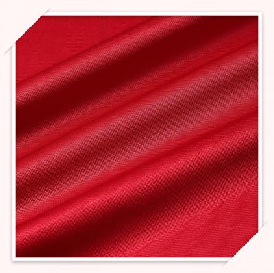 China Abrasion-resistant red color polyester luster fabric sustainable fabric soft good luster fabric for clothing for sale