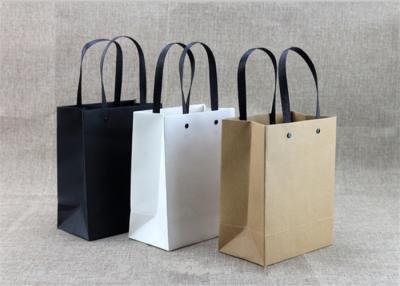 China Partial UVcoating Eco Printed Kraft Custom Paper Shopping Bags With Ribbon for sale