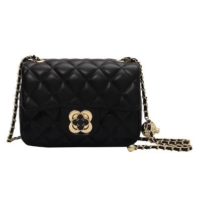 China Newspaper Used 2023 Small Gold Ball New Small Scented Clover Diamond Chain Lady's Shoulder Cross - Body Bag for sale