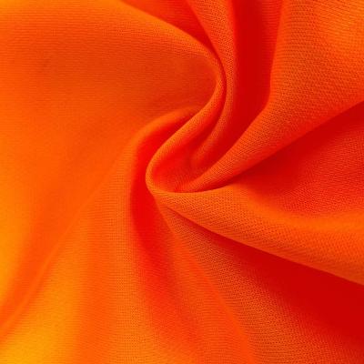 China Free Sample Dry Fit 100% Polyester Anti-Static Fluorescence Fabric Eyelet Bird Eye Mesh Fabric For Sports Wear for sale