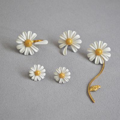 China European and American European and American silver needle small daisy white flower painting design jewelry romantic asymmetric 925 female earrings for sale