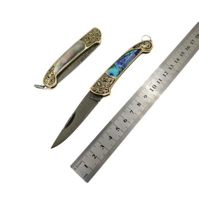 China Exquisite High Quality Non-variable Blade Knife Damascus Steel Folding Blade With Shell And Edged Brass Handle for sale