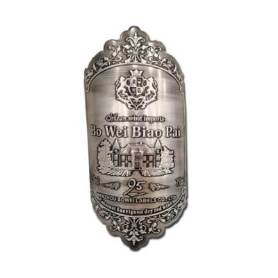 China 3D embossed metal wine bottle label and perfume bottle label maker for sale