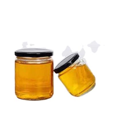 China Wholesale Personal Cheap Empty Honey Bee Food Storage Glass Jar For Canning With Metal Lid for sale