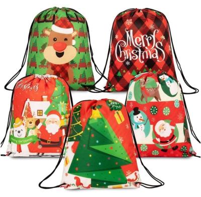 China Santa Snowman Backpack Reusable Candy Treat Christmas Tree Reindeer Drawstring Bags Xmas Gift Bag Wrapping Bags For Birthday Xmas for sale