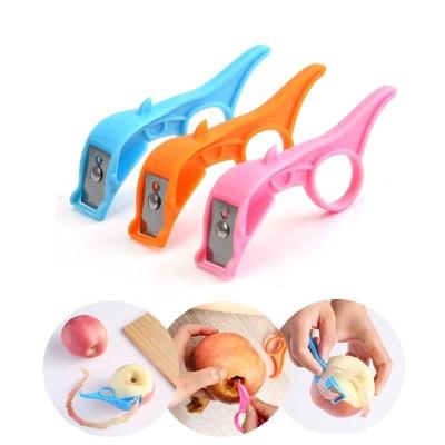 China Plastic Creative Orange Ring Melon Planer Paring Knife Peeler Kitchen Fruit Peeler Viable Kitchen Tool factory universal dropshipping for sale