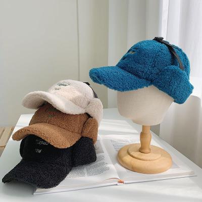 China Embroidery COMMON Letter Hat Earflap Hat Winter Fur Peaked Hat for sale