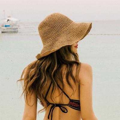 China Korean Woven Character Sun Visor Bucket Covers Raffia Wide Folding Brim Straw Beach Hats for sale