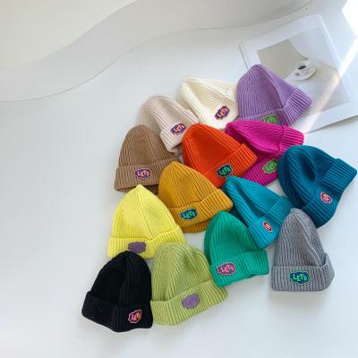 China Wholesal JOINT Cute Kids Hats Kids Warm Hat Color Winter Letter Hats Knit Beanie for sale