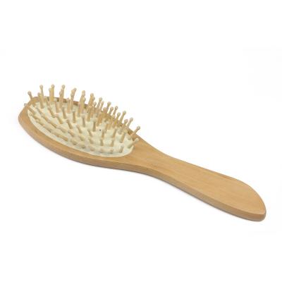 China Low Price Natural High Quality Wooden Paddle Hair Brush With 70 Holes for sale