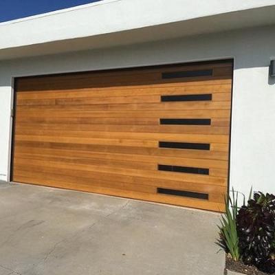 China Waterproof electrically opened wooden garage door for sale