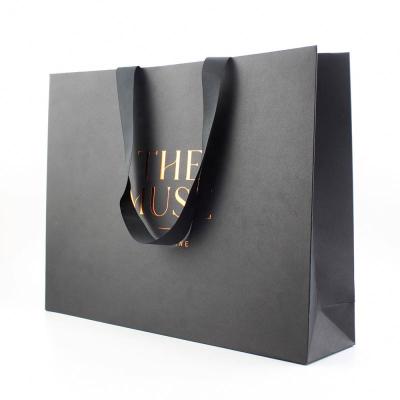 China Recyclable Creative Paper Customize Customized Kraft Paper Gift Wrapping Black Retail Clothing Bag Matt Hot Foil Luxury Paper for sale