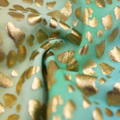 China Gold leopard sequin color changing 82%nylon 18%spandex foil fabric for sublimation for sale