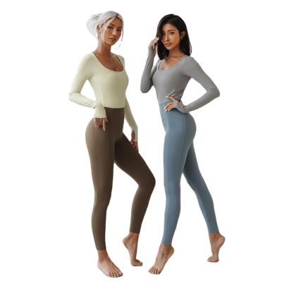 China Breathable Women Backless Long Sleeve Sports Jumpsuit Yoga Stretch Top And Legging One Piece Sets For Workout Gym Fitness Romper for sale