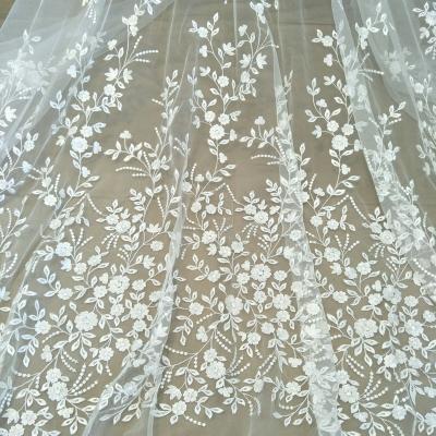 China Other Fabric Wedding Dress Ivory White With Small Flowers And Sequin Dress Fabric 130cm Wide for sale