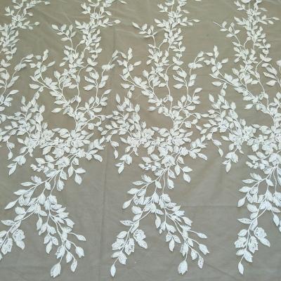 China Other Small Leaves Laser Flower Fabric New Ivory White Wedding Dress Fabric With Sequin Width 130cm for sale