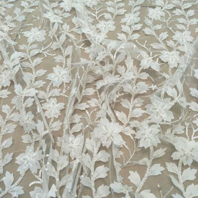 China Other fashion ivory 3D beading lace fabric 130cm width dress lace fabric wedding dress lace for sell by the yard for sale