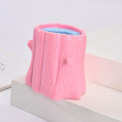 China Relieve Stress Squeeze Squirrel Cup Kids Funny Toys Bad Decompression Tree Stumps Wiggle Toys for sale