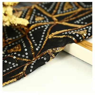 China Shrink-Resistant Robe Even Wedding Dress Embroidered Fabric , 3mm Laminated Triangular Bright Sequin Fabric Black Gold for sale