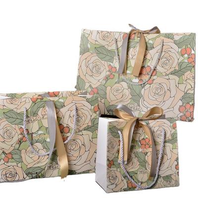 China High Quality Recycled Materials Gift Bag Champagne Rose Gift Bag With Ribbon With New Design Wholesale for sale