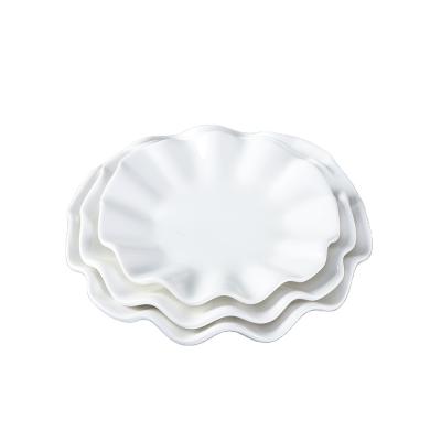 China Viable Edge Irregular Flower Round White Porcelain Dish for sale