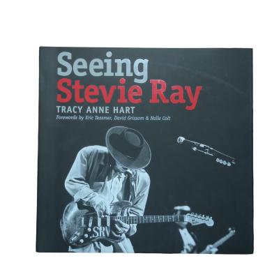 China Seeing Stevie Ray | Customized Jacketed Coffee Table Book Printing With Offset Technology And Spot UV On 105 Gsm Paper for sale