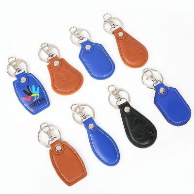 China Simple Advertising Logo Water Bank Drop Key Flag Blue Brown Round Oval Engraved Keyring Faux Leather PU Heart Leather Keychain Blank for sale