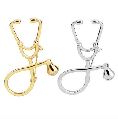 China New Custom Fashion Stitch 5cm Doctor Stethoscope Brooch Pin With Rhinestone Safety Pin On The Back for sale