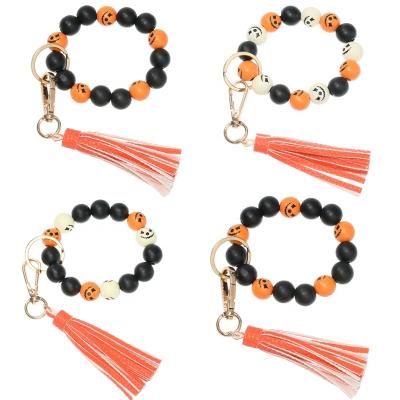 China Wooden Bracelet Key Chain Orange Halloween Beads Key Chain Holder For Color Leather Wooden Bracelet Candy Keyring Bead Gift PU Tassel Key Chain for sale