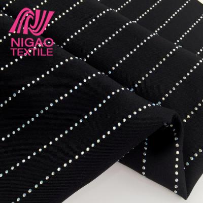 China Shrink-Resistant Stock Luxurious Rhinestone Covered Fabric Vertical Pattern Crystal Fabric For Dress Suit Jacket for sale