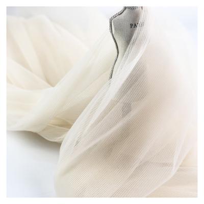 China Shrink-Resistant Fancy Design Tulle Flower Pattern Polyester Pleats Fabric Dress Crepe Fabric For Wedding Lace Dress Dress for sale