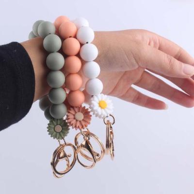 China FASHION Daisy Charm Bracelet Keychain For Women Silicon Beads Wrist Bag Key Chain Pendant Key Accessory for sale