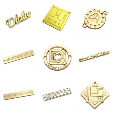 China Custom Imitation Logo Clothing Label Makers Metal Gold Sewing Labels Viable For Swimwear for sale