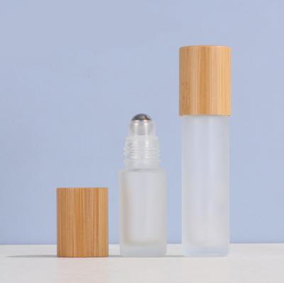 China Package New Products Engraving Logo 100% Organic Bamboo Cosmetic Packaging Bamboo Roll Beautiful On Empty Bottle for sale