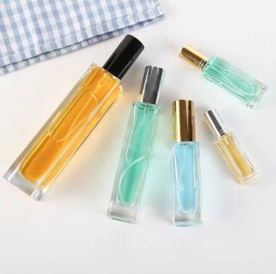 China 50ml 80ml 100ml inner color empty glass perfume bottle wholesale luxury paint cosmetic for sale