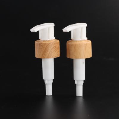 China Non Spill Plastic Water Transfer Lotion Pump Wood Grain PP Left Right Lock Lotion Pump With Clip for sale