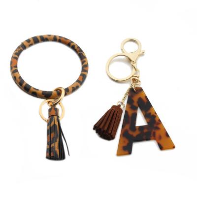 China New Leopard Print PU Bracelet Bangle Bag Creative Acrylic Letter Leather Pendant Gift Letter Shape Accessories Key Chain for sale