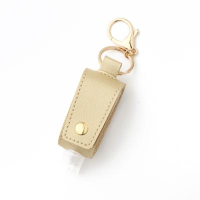 China Leather bag bottle hand sanitizer gift promotion PU box case key pendant perfume bottle key chain for sale