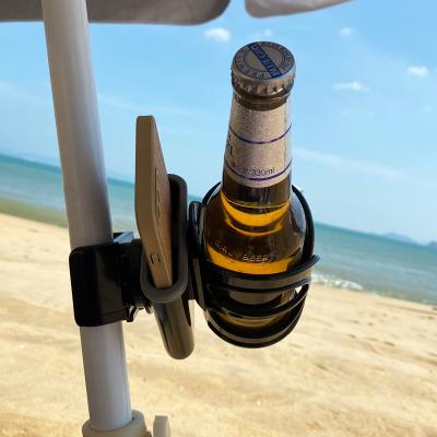 China Minimalist Drinks Cup Holder With Mobile Phone Slot Beach Sand Coasters Cup Holder Camping Sun Umbrella Tube Outdoor Wine Holder for sale