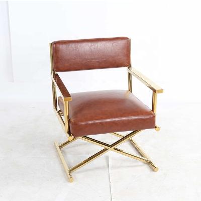 China Custom production fashion X accent chair luxury gold stainless steel low dark red leather lounge chair for hotel home for sale