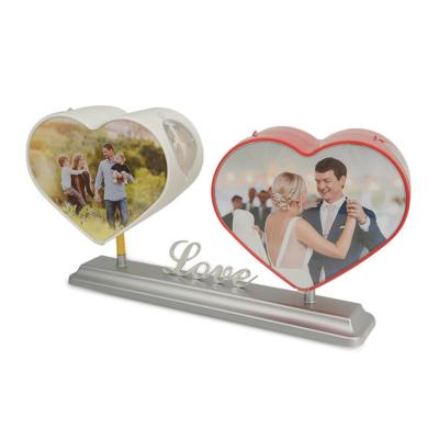 China Rotating Double Heart Plastic Rotating Photo Frame For Birthday Put On Photo for sale