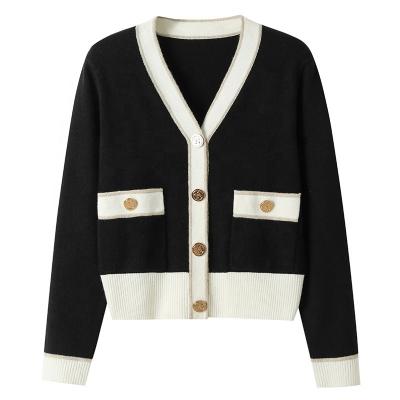 China Anti-wrinkle fashion pearl button pocket OEM white black women knitted sweater cardigan for sale