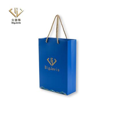 China Custom design fashion beauty shopping gift wholesale high quality recyclable luxury paper bag printed flat handle blue color packaging for sale