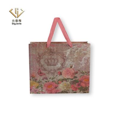 China Wholesale Eco Friendly Recyclable Paper Bag Rose Christmas Gift Packaging Custom Luxury Logo Printed Carrying Shopping Bags With Handle for sale