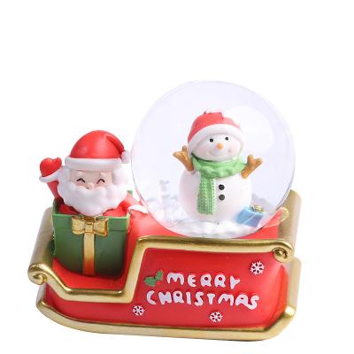 China 2023 Commemorative Art Christmas Ornaments Santa Snow Crystal Ball Resin Home Hotel Folk Table Decoration Christmas Gifts For Children for sale