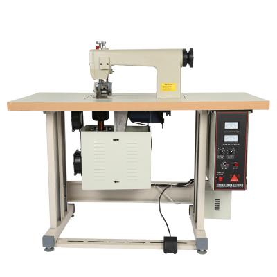 China Garment Shops Drum Seamless Nonwoven Fabric Barring Lace Ultrasonic Cutting Welding Sewing Machine for sale