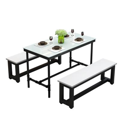 China Design Modern Style Water Pipe Dining Table Tempered Glass Water Pipe Style Furniture Black Metal Legs for sale