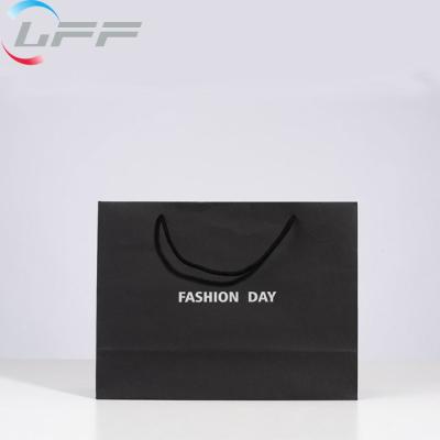 China Custom Cheap Biodegradable White And Black Retail Luxury Gift Paper Bag for sale