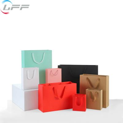 China Custom Logo Printed Gift Shopping Paper Recyclable Bags With Ribbon Handles for sale