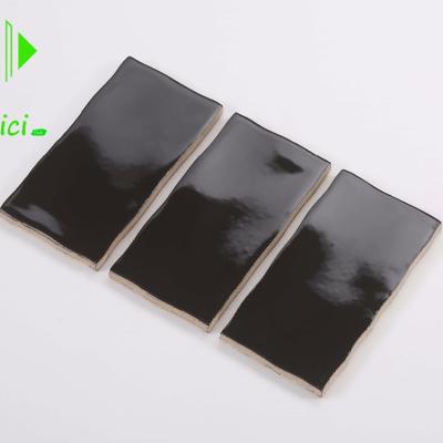 China Rustic Black Glazed Tiles 3x6 Ceramic Tiles Wall Subway Wave Edge for sale